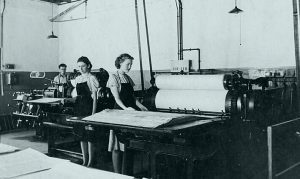 Historical image of women working at printing press